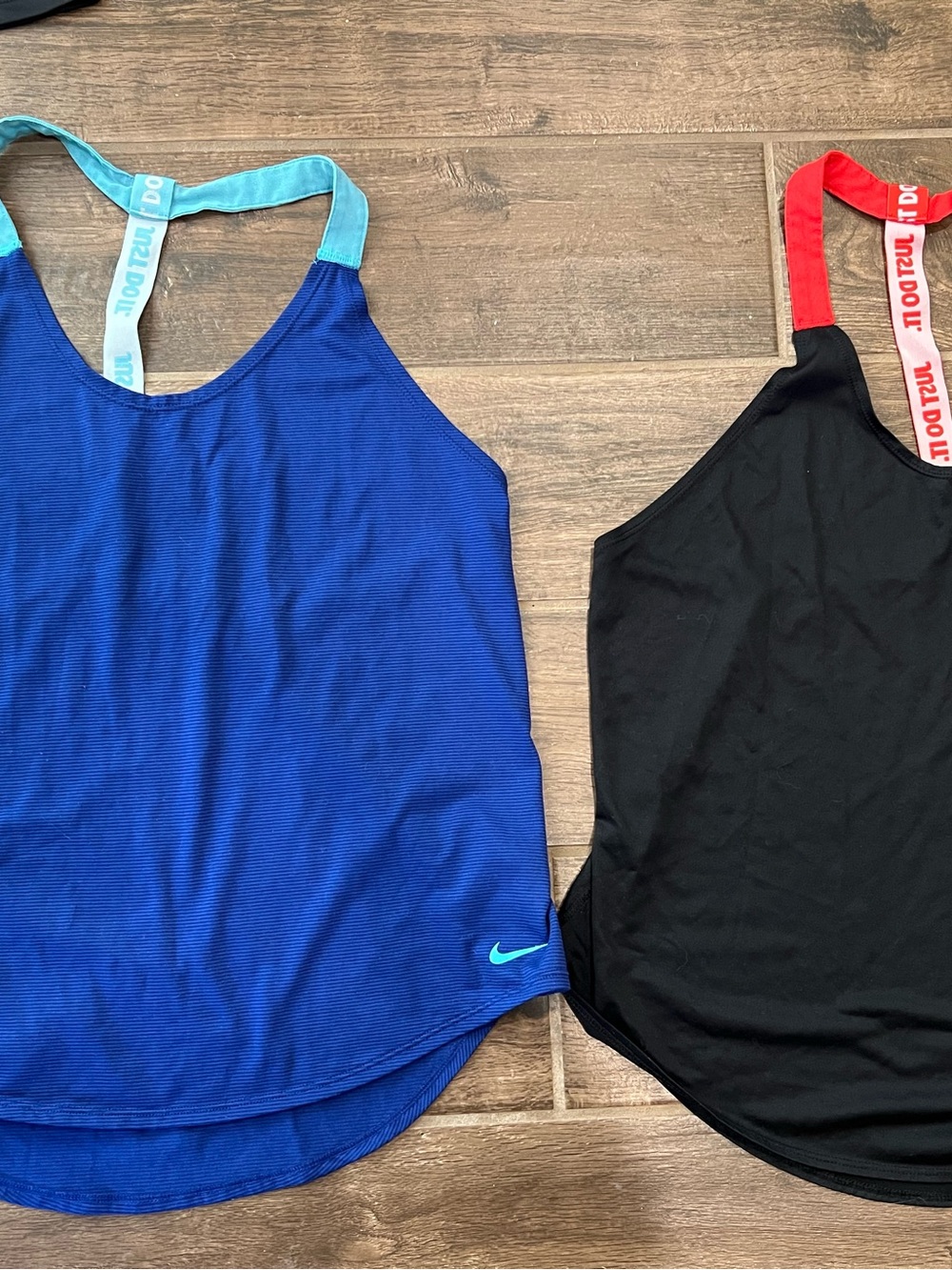 Nike Blue Tank Top with Light Blue Straps and Black with red straps. Both L